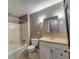 This bathroom features neutral paint, white vanity, shower and tub at 11511 Highway 92, Woodstock, GA 30188