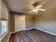 This bedroom features wood-look floors, closet, neutral paint, ceiling fan and lots of light at 11511 Highway 92, Woodstock, GA 30188