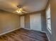 This bedroom features wood-look floors, closet, neutral paint and lots of light at 11511 Highway 92, Woodstock, GA 30188