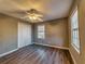 This cozy bedroom features wood-look floors, neutral paint and ceiling fan at 11511 Highway 92, Woodstock, GA 30188