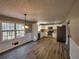Bright kitchen boasts stainless steel appliances, white cabinetry, and hardwood flooring at 11511 Highway 92, Woodstock, GA 30188