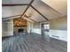 Spacious living room features a stone fireplace, built-in shelving, and vaulted ceilings at 11511 Highway 92, Woodstock, GA 30188
