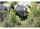 Aerial of the home surrounded by lush trees, highlighting privacy and backyard access at 2930 Aquitania Ln, Cumming, GA 30040