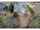 Aerial view of the rear of a brick house featuring a deck, stairs and lawn at 2930 Aquitania Ln, Cumming, GA 30040