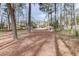 The large backyard offers wooded privacy behind this attractive home at 2930 Aquitania Ln, Cumming, GA 30040