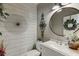 Stylish half bathroom boasts elegant decor and modern fixtures at 2930 Aquitania Ln, Cumming, GA 30040