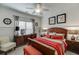 Comfortable bedroom features wainscoting, carpeted floors and a large window at 2930 Aquitania Ln, Cumming, GA 30040