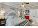 Inviting bedroom with carpeted floors, a ceiling fan and a large closet at 2930 Aquitania Ln, Cumming, GA 30040