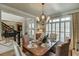 Formal dining room with crown molding, window shutters, and staircase visible at 2930 Aquitania Ln, Cumming, GA 30040