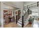 Grand foyer showcases elegant staircase, hardwood floors, chandelier, and an open view into the dining and living spaces at 2930 Aquitania Ln, Cumming, GA 30040