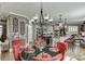 Open kitchen and dining area with brick accents, stainless appliances, and breakfast bar at 2930 Aquitania Ln, Cumming, GA 30040