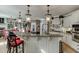 Beautiful kitchen with granite countertops, stainless steel appliances, and bar seating for entertaining at 2930 Aquitania Ln, Cumming, GA 30040