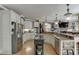 Well-equipped kitchen with stainless steel appliances, granite countertops, and an island with bar seating at 2930 Aquitania Ln, Cumming, GA 30040