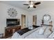 Cozy primary bedroom with carpeted floors, ceiling fan and access to the ensuite bath at 2930 Aquitania Ln, Cumming, GA 30040