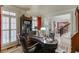 Comfortable office space with custom desk, bookshelves, natural light, and access to the home's elegant foyer at 2930 Aquitania Ln, Cumming, GA 30040