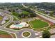 An aerial view showcases the community pool, clubhouse, and green space at 4259 Baden Aly, Duluth, GA 30097