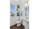Bright bathroom featuring a pedestal sink, modern fixtures, and decorative artwork creating a fresh aesthetic at 4259 Baden Aly, Duluth, GA 30097