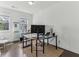 Stylish home office with natural light, modern desk setup, and hardwood floors for a productive workspace at 4259 Baden Aly, Duluth, GA 30097