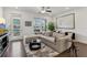 Well-lit living room with stylish furniture, a view to the outside balcony, and modern décor elements at 4259 Baden Aly, Duluth, GA 30097