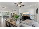 Open-concept living area seamlessly connected to the kitchen, featuring modern decor and lots of natural light at 4259 Baden Aly, Duluth, GA 30097