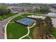 Aerial shot of well-maintained tennis courts within a neighborhood near a pond at 4259 Baden Aly, Duluth, GA 30097
