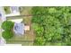 Aerial view delineating property lines around the house, deck, and surrounding woodland, approx. 1.12 acres at 60 Heritage Keep, Covington, GA 30016