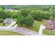 Aerial shot of the property highlighting its location amidst lush greenery and surrounding homes at 60 Heritage Keep, Covington, GA 30016