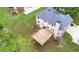 A large backyard view showcases a two story home with a newly built wooden deck and green grass at 60 Heritage Keep, Covington, GA 30016