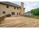 Large wooden deck extends from the house, offering an ideal spot for barbecues and relaxation at 60 Heritage Keep, Covington, GA 30016