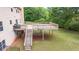 Multi-level wooden deck with stairs provides easy access to the backyard and enhances outdoor living at 60 Heritage Keep, Covington, GA 30016