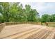 Expansive wooden deck provides ample space for outdoor entertaining in a private, wooded setting at 60 Heritage Keep, Covington, GA 30016