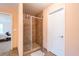 Bathroom featuring tiled shower and a doorway leading to the primary bedroom, providing both style and function at 60 Heritage Keep, Covington, GA 30016