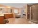 Spacious bathroom with a jacuzzi tub, tiled floors, a shower, and lots of cabinet space at 60 Heritage Keep, Covington, GA 30016