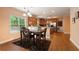 Bright breakfast nook features backyard views and flows into the modern kitchen at 60 Heritage Keep, Covington, GA 30016