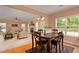 Dining area showcasing hardwood floors, an open layout, and seamless transitions to the living space at 60 Heritage Keep, Covington, GA 30016
