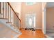 Grand foyer featuring hardwood floors, staircase, and natural light at 60 Heritage Keep, Covington, GA 30016