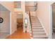 Spacious foyer features beautiful hardwood floors and an open staircase at 60 Heritage Keep, Covington, GA 30016