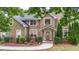 Charming brick home with well-kept landscaping and welcoming front entrance at 60 Heritage Keep, Covington, GA 30016