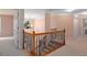 Upstairs hallway featuring views of the staircase and natural lighting at 60 Heritage Keep, Covington, GA 30016