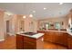 Kitchen boasting an island, ample counter space, and easy access to other living areas at 60 Heritage Keep, Covington, GA 30016