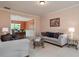 Comfortable living room showcasing a seamless connection to dining area at 60 Heritage Keep, Covington, GA 30016