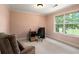 Bright home office space, perfect for work or study, with neutral color palette and bright window at 60 Heritage Keep, Covington, GA 30016