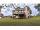 Back of house with deck and expansive yard, creating a peaceful retreat at 60 Heritage Keep, Covington, GA 30016