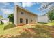 The home's backyard features a well-kept lawn and the rear of the house at 1023 Saint Augustine Pkwy, Locust Grove, GA 30248
