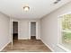 Bedroom with two closets, fresh paint and hardwood-style floors at 1023 Saint Augustine Pkwy, Locust Grove, GA 30248