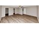 A view of a bedroom featuring two walk-in closets and laminate flooring at 1023 Saint Augustine Pkwy, Locust Grove, GA 30248