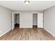 A neutral bedroom provides two closet options and has light-colored laminate flooring at 1023 Saint Augustine Pkwy, Locust Grove, GA 30248