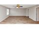 Open bedroom with a ceiling fan, laminate floors, natural light and fresh paint at 1023 Saint Augustine Pkwy, Locust Grove, GA 30248