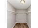 Walk in closet with racks for organizing clothes at 1023 Saint Augustine Pkwy, Locust Grove, GA 30248