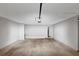 Empty garage shows an automatic door and enough room for storage at 1023 Saint Augustine Pkwy, Locust Grove, GA 30248